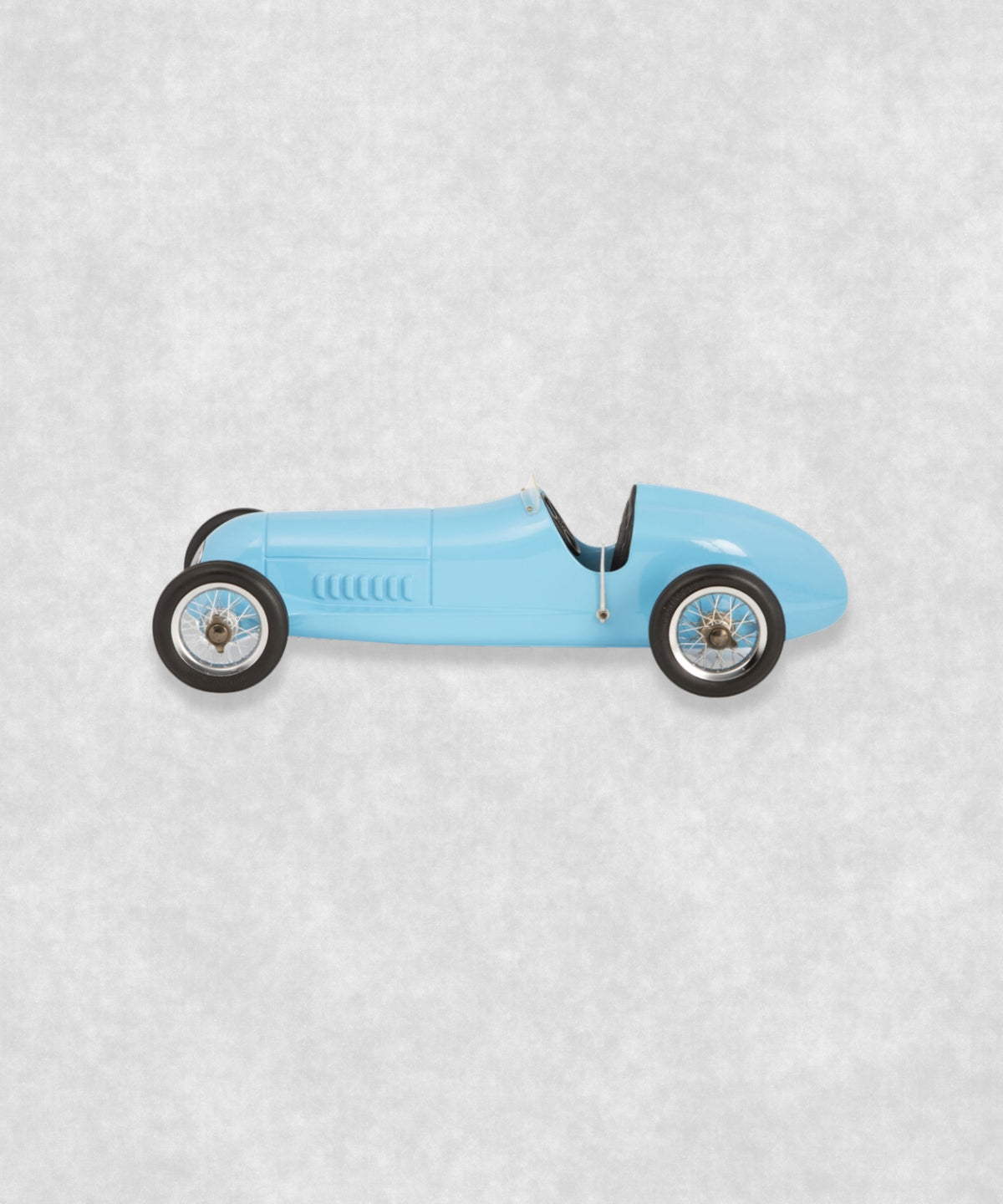 Vintage racing silberfeil car model inspired by classic Grand Prix racers and Silver Arrow legends, featuring a blue race car body with a striking black seat. A collectible car model for motorsport and classic car enthusiasts. Viewed from the left side.