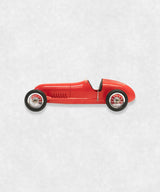 Vintage racing silberfeil car model inspired by classic Grand Prix racers and Silver Arrow legends, featuring a red race car body with a striking black seat. A collectible car model for motorsport and classic car enthusiasts. Viewed from  the left side.