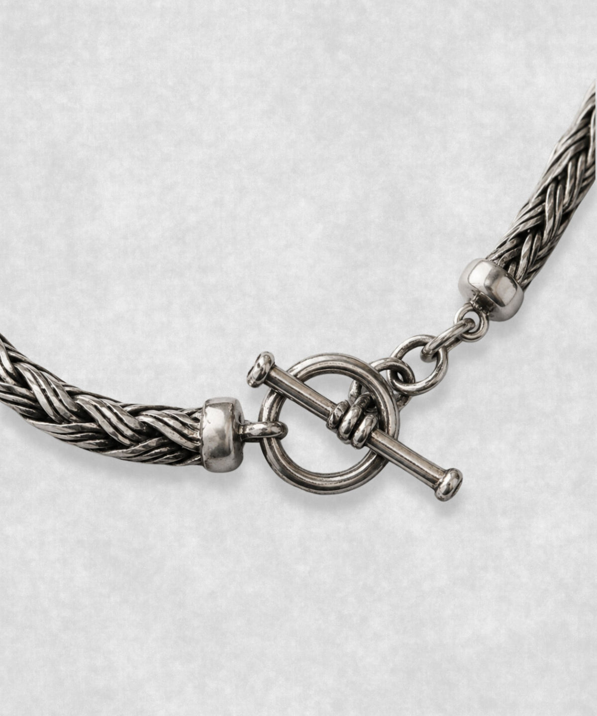 Close-up of The Braid sterling silver bracelet toggle clasp – handcrafted 925 silver braided chain detail