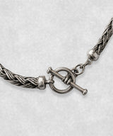 Close-up of The Braid sterling silver bracelet toggle clasp – handcrafted 925 silver braided chain detail