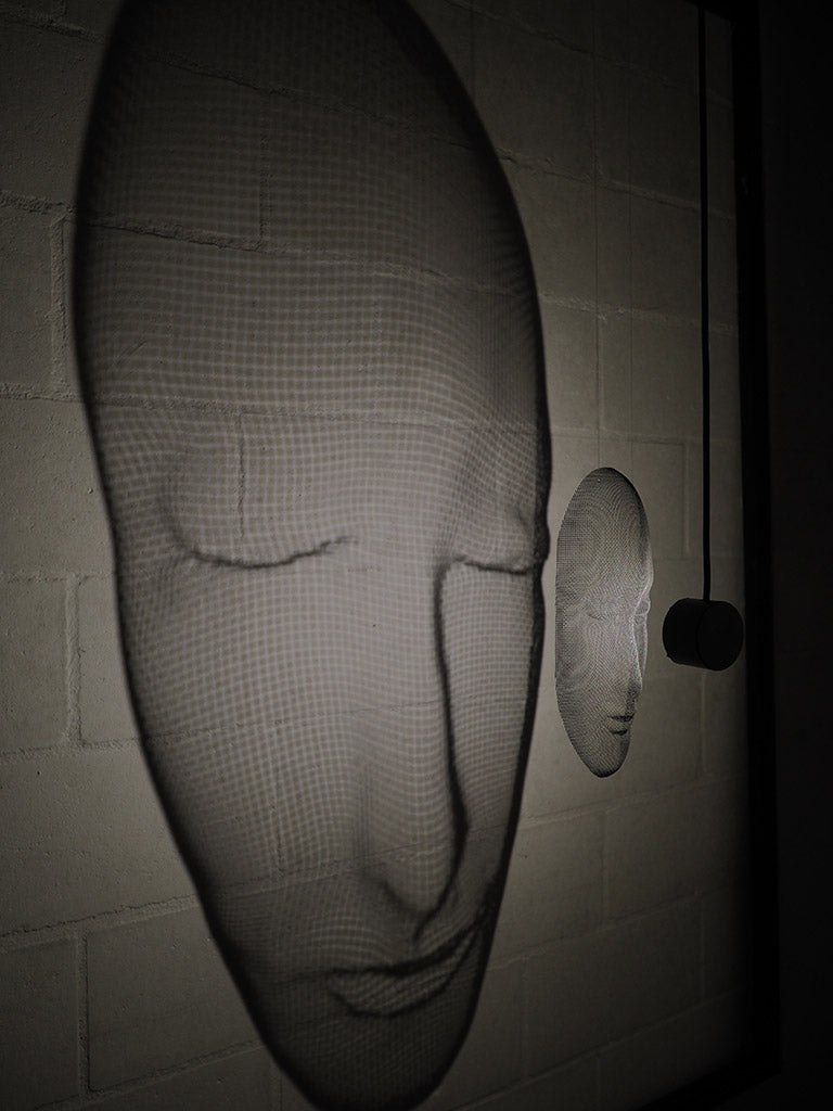 Arturo Álvarez illuminated mesh mask wall sculpture – handcrafted metallic mesh revealing sculptural depth, translucent texture and light